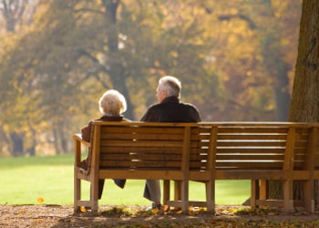 Elderly couple sitting on a bench