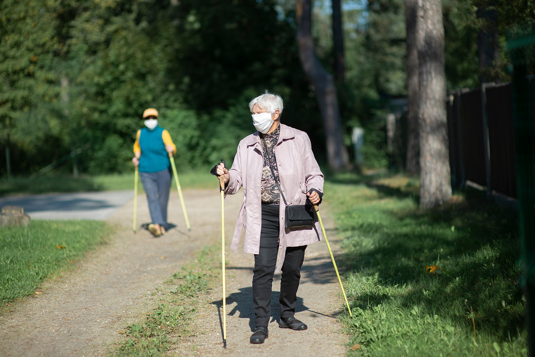 assisted living residents outside for a walk